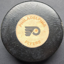 Load image into Gallery viewer, Circa 1979-1983 Philadelphia Flyers Game Used Hockey Puck NHL VTG Leach Barber