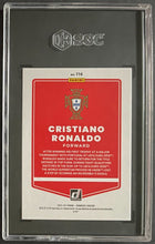 Load image into Gallery viewer, 2021 Donruss Road to Qatar Cristiano Ronaldo #116 Holo Red Laser 60/99 SGC 9.5
